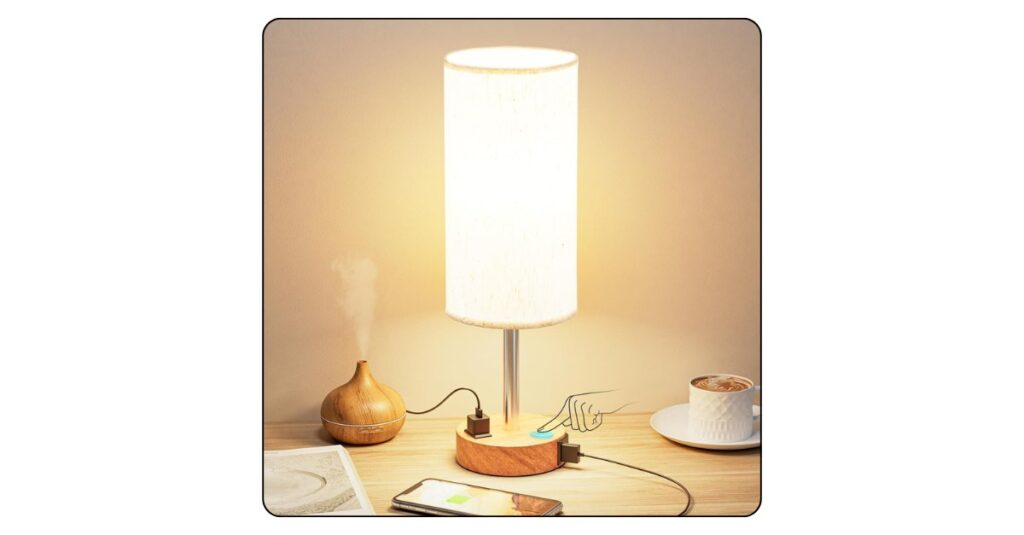 Contemporary bedside table lamp with warm lighting for a cozy bedroom.