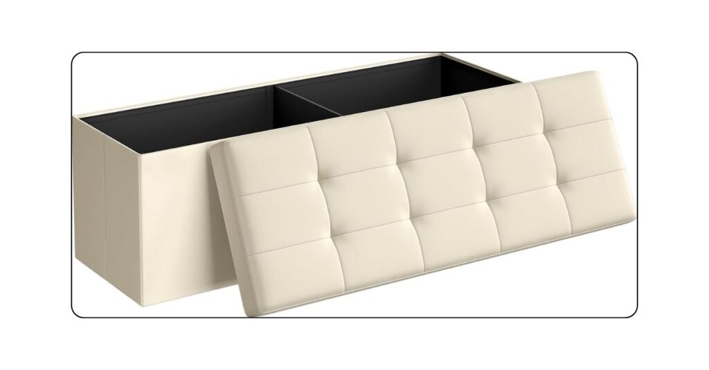 Upholstered storage bench positioned at the foot of a luxury bed.
