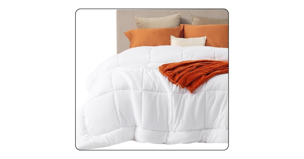 White luxury comforter set with layered bedding for a cozy modern bedroom.